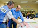 Santa Cruz ARES® Team Member Don Taylor, K6GHA (left), discusses evacuation center operations with Santa Cruz County Director of Emergency Operations Paul Horvat. [Craig Smith, W6WL, Photo]
